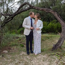 Frankie and Nicole kiss under the natural arbour tree at Broadbeach